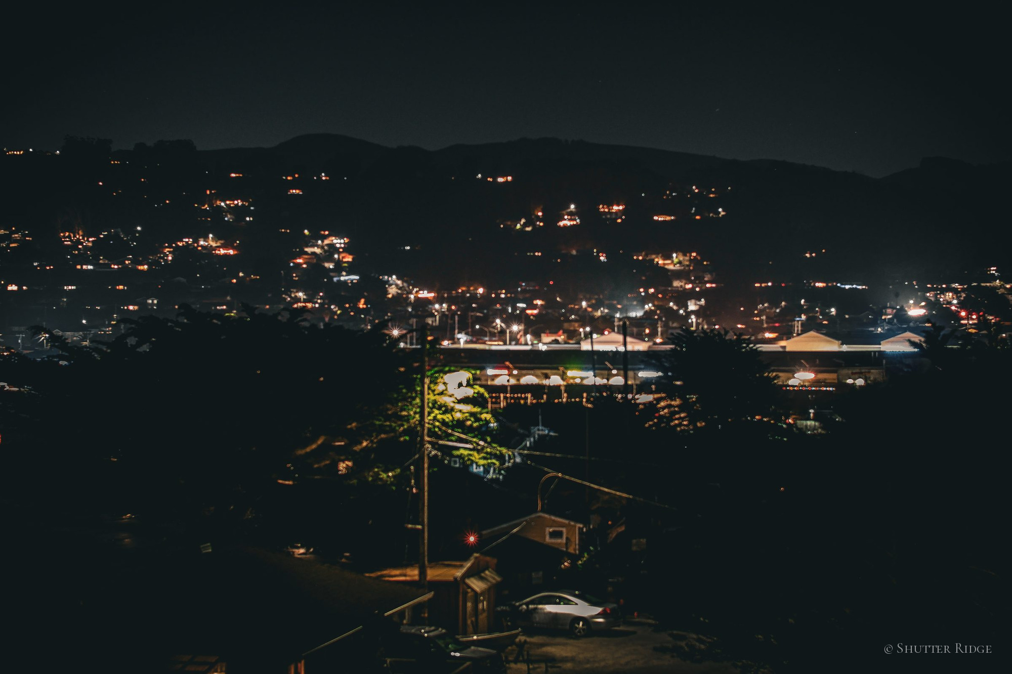 Hillside town lights at night